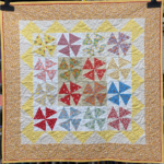 Photo of Quilt: PeakyPinwheels.SuzandeSerres